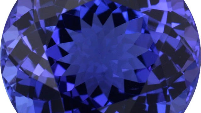 Round brilliant-cut violet-blue tanzanite photographed face-up at Sapphire Row, its crown facets showing bright, evenly distributed light return and no window