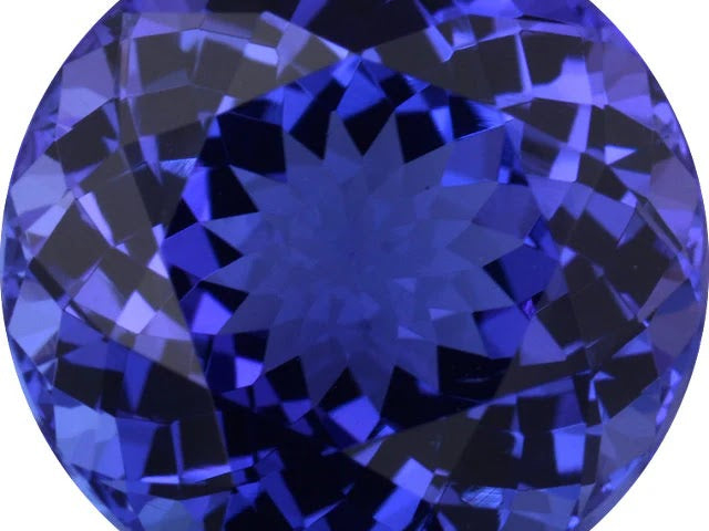 Round brilliant-cut violetish blue tanzanite photographed face-up at Sapphire Row, showing bright, evenly distributed light return across the crown facets — tanzanite is a species that is almost always heat treated