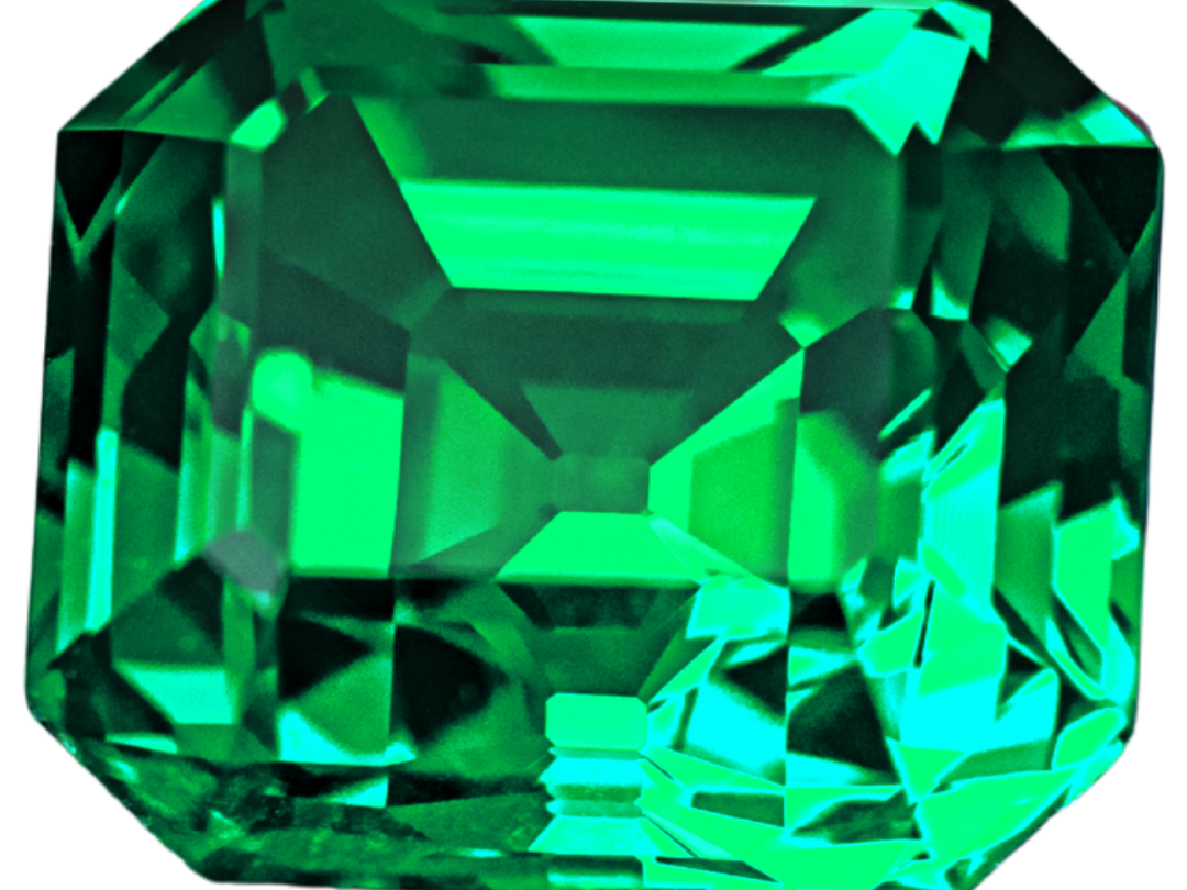 Vivid, slightly bluish green emerald in a step (emerald) cut, photographed on a light gray background