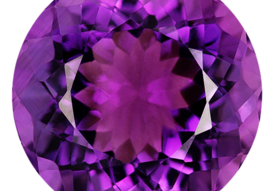 Round brilliant-cut amethyst in a vivid reddish purple with violet-purple flashes around the crown, photographed face-up on a pale gray background at Sapphire Row