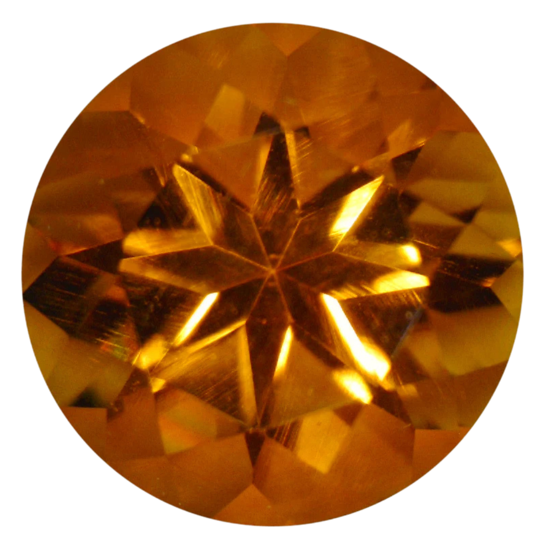 Round star-cut citrine in a vivid yellowish orange with a warm honey-gold core, photographed face-up on a pale gray background at Sapphire Row, its pinwheel facet pattern radiating from the culet