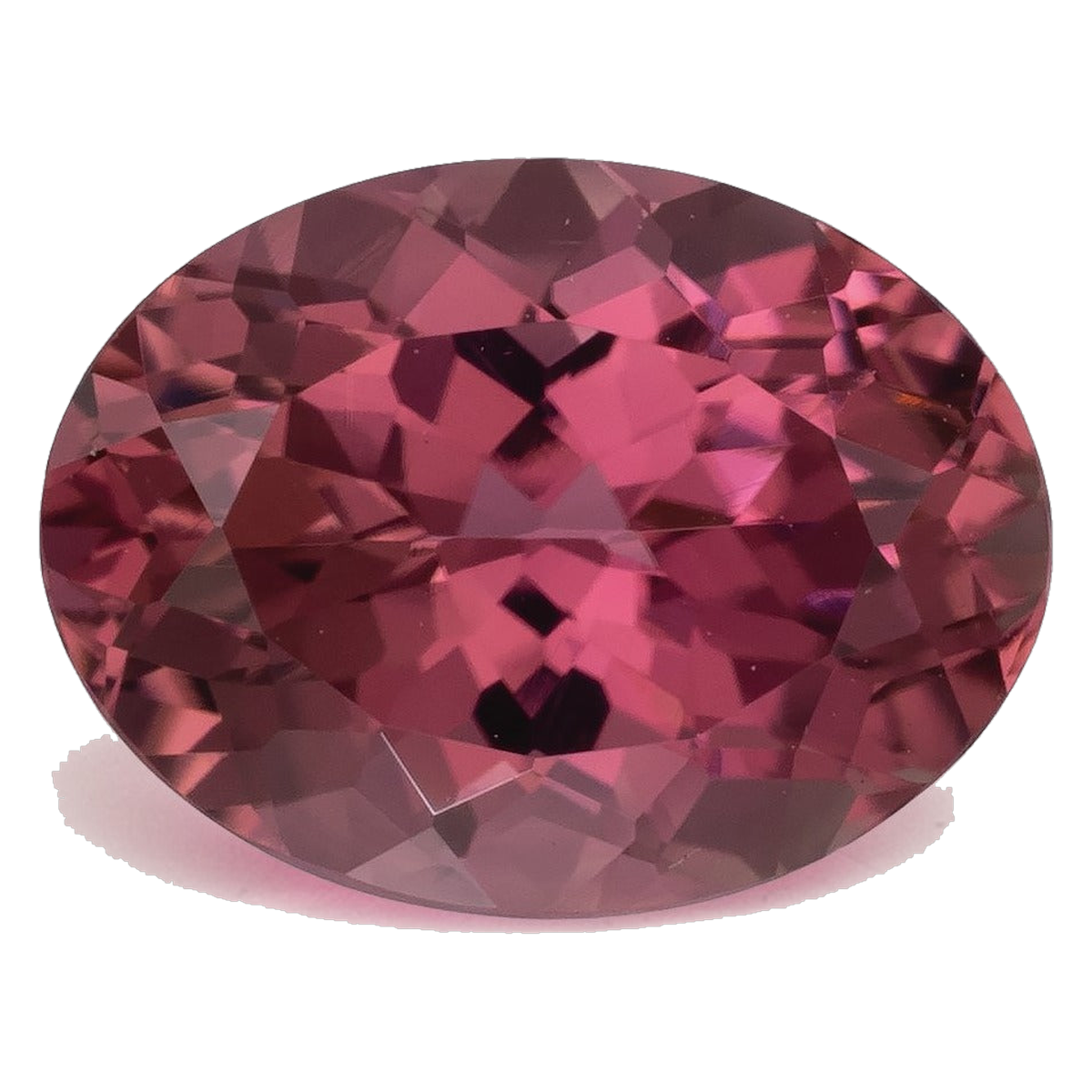 Oval mixed-cut natural pink tourmaline in a medium-dark slightly purplish pink with raspberry depth, photographed face-up on a pale gray background at Sapphire Row