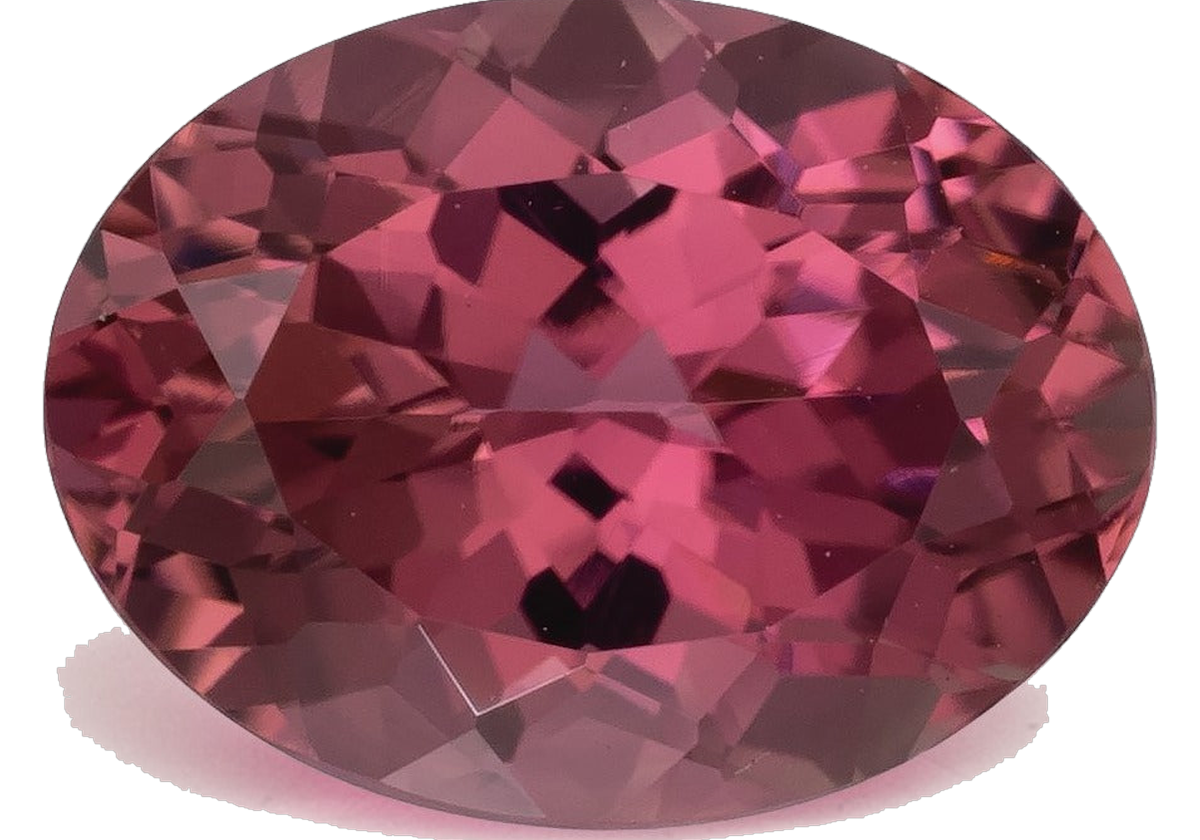 Oval mixed-cut natural pink tourmaline in a medium-dark slightly purplish pink with raspberry depth, photographed face-up on a pale gray background at Sapphire Row