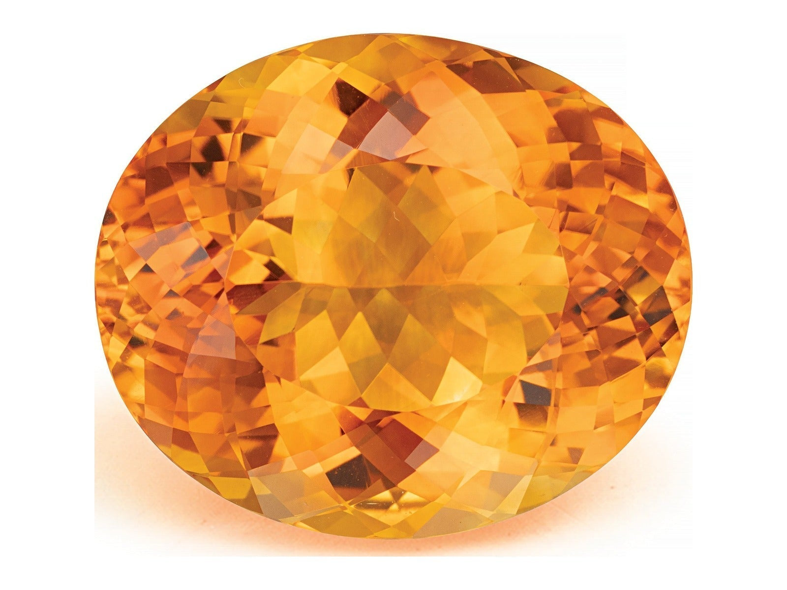 Large oval checkerboard-cut natural citrine from Brazil in a vivid medium orange with a golden yellow core and deeper reddish flashes through the pavilion, photographed face-up on a white background at Sapphire Row