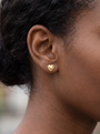 Gold Beaded Heart Stud Earrings in 14K Yellow Gold, worn on the ear