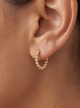 Gold Beaded Hoop Earrings in 14K Yellow Gold, shown close on the ear