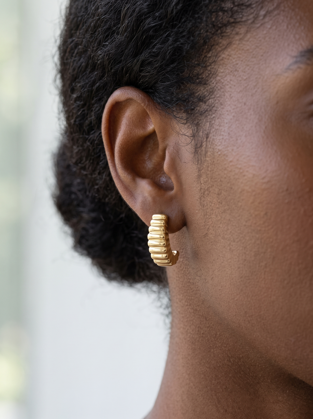 Gold Puffed J-Hoop Earrings in 14K Yellow Gold, worn on the ear