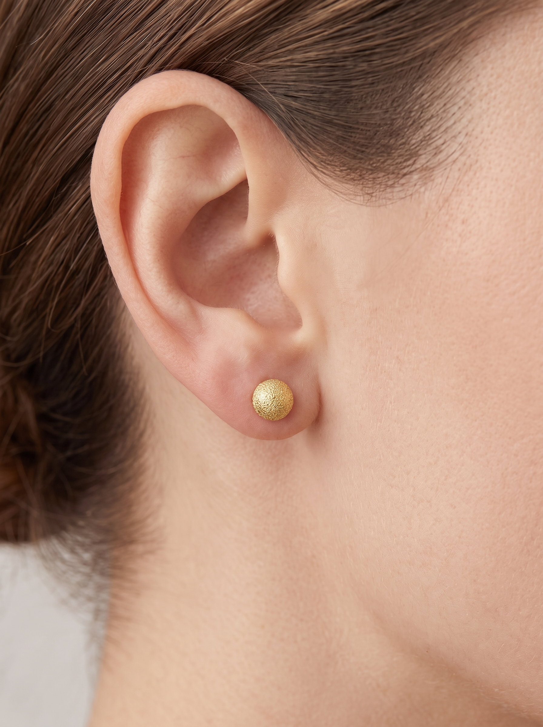 Gold Stardust Ball Stud Earrings in 14K Yellow Gold, worn on the ear