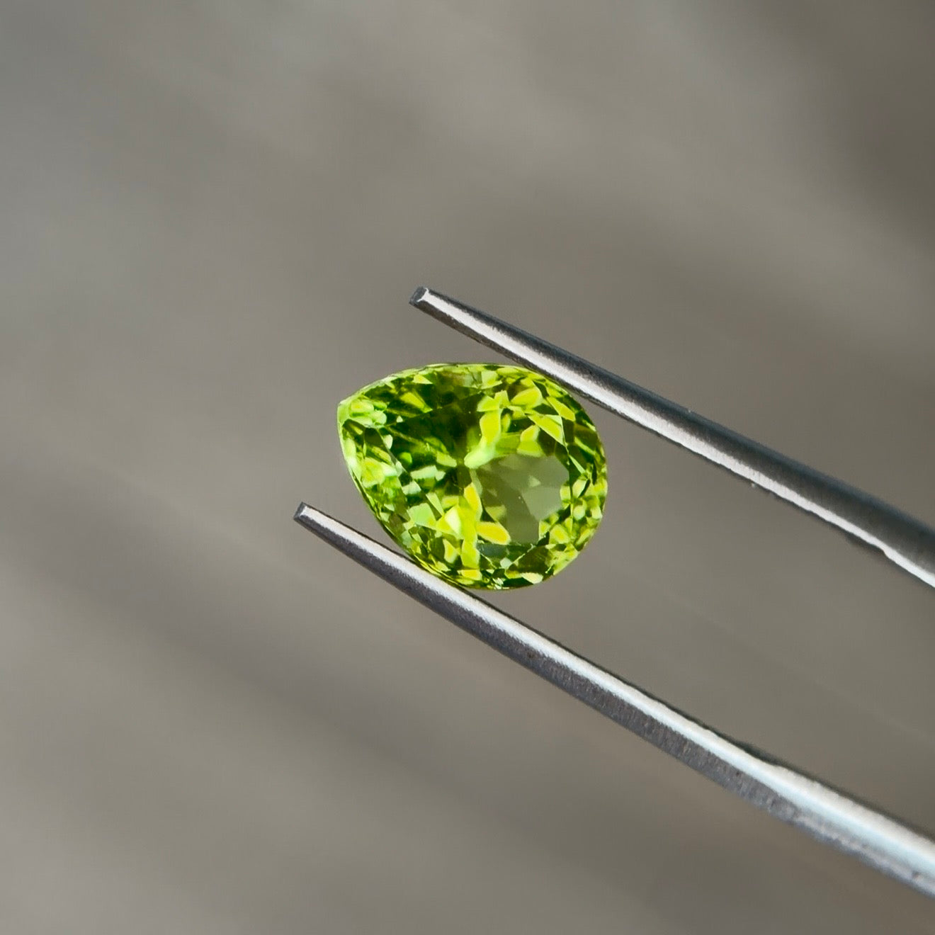 2.42 ct Natural Peridot Olive Green – Pear Cut – AIG Certified