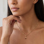 Natural Garnet Cherry Charm in 14K Yellow Gold, worn at the neckline on a paperclip chain shown for styling
