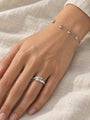 Gold Bead Station Bracelet in 14K White Gold, worn on the wrist with a domed bypass ring