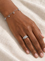 Gold Bead Station Bracelet in 14K White Gold, shown close at the wrist, five polished bead drops, with a domed bypass ring