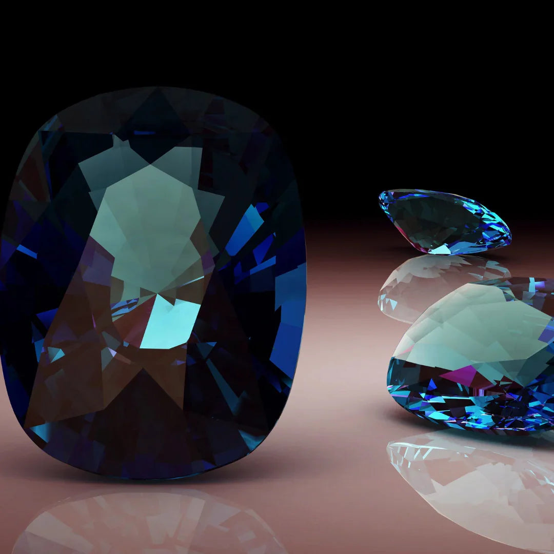 Loose bluish-green alexandrite gemstones with faceted cuts