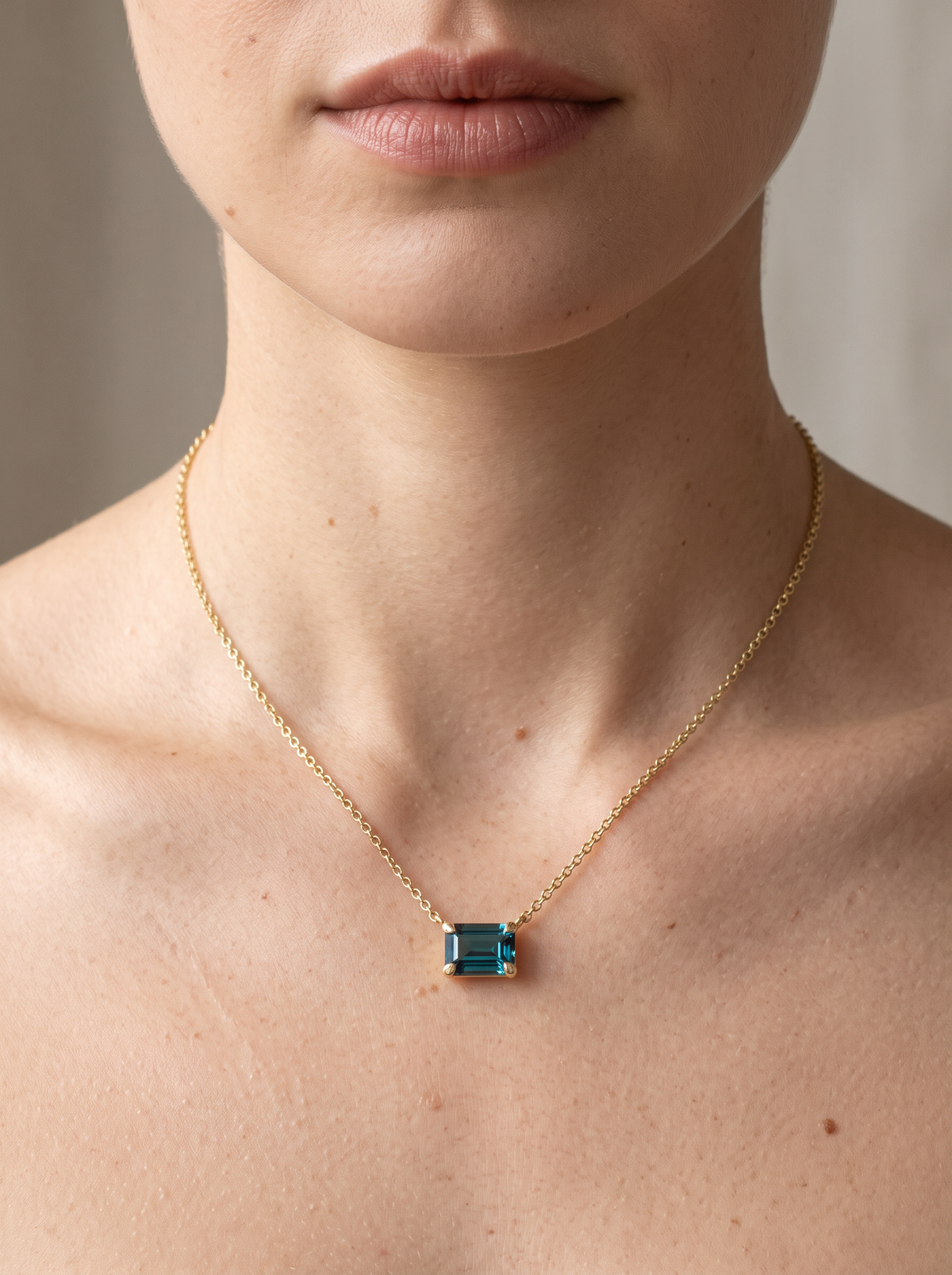 Lab-Grown Emerald-Cut Gemstone Necklace in 14K Yellow Gold, Alexandrite, worn at the collarbone