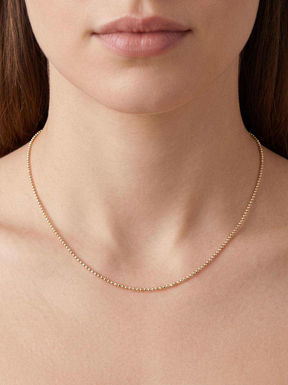10K Gold Diamond-Cut Bead Chain Necklace, shown close at the collarbone