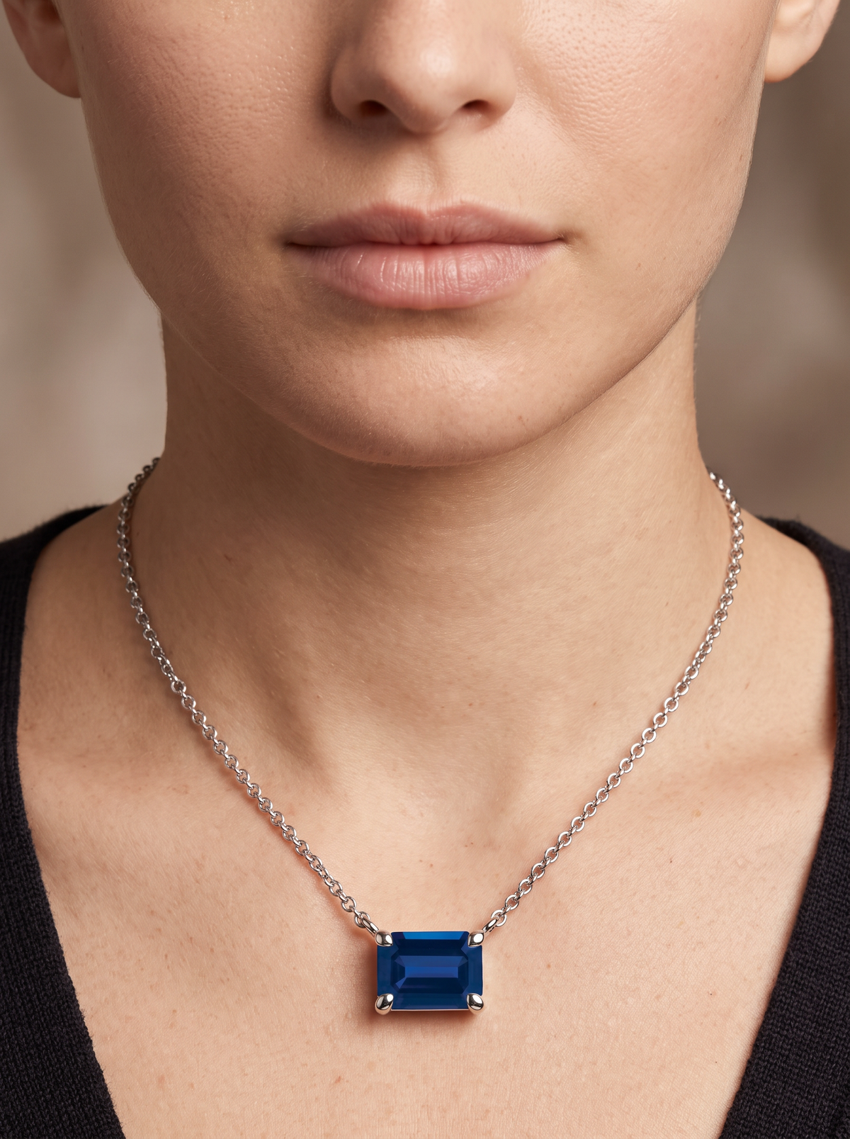 Lab-Grown Emerald-Cut Gemstone Necklace in 14K White Gold, Blue Sapphire, shown close at the collarbone
