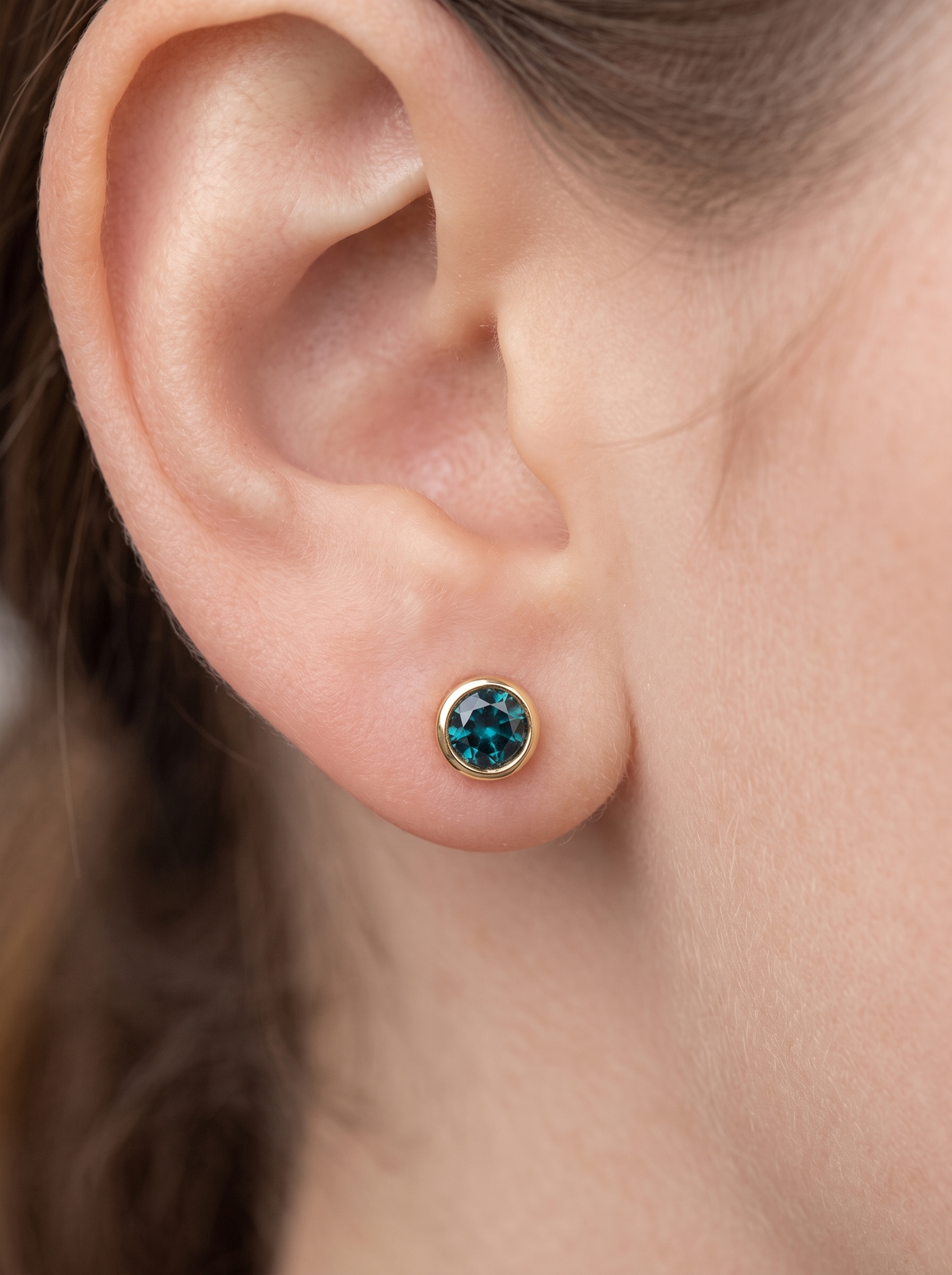 Children's Lab-Grown Birthstone Screwback Studs in 14K Yellow Gold, shown close on the ear
