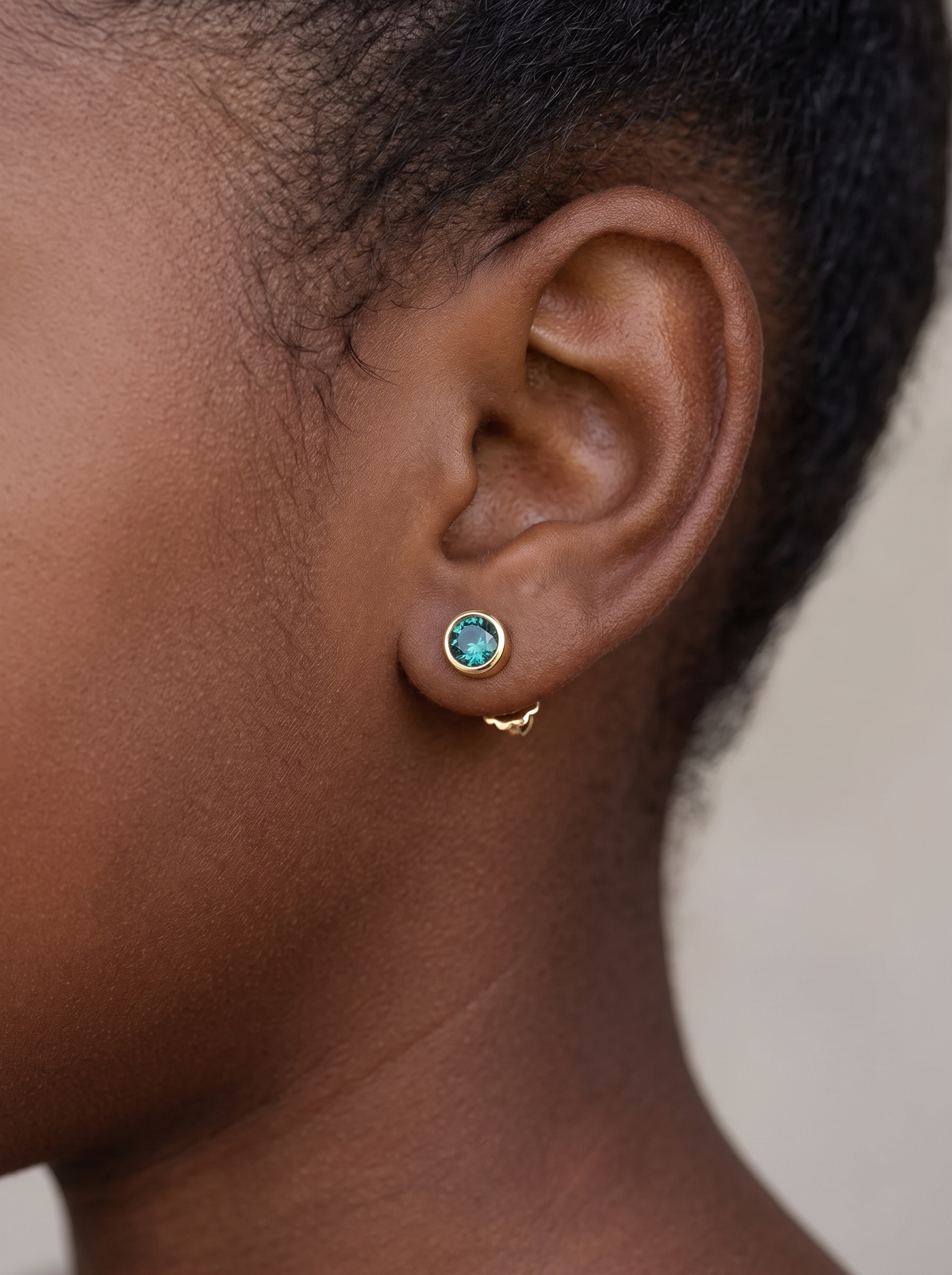 Children's Lab-Grown Birthstone Screwback Studs in 14K Yellow Gold, worn on the ear
