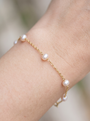 Cultured Pearl Station Bracelet in 14K Yellow Gold, shown close on the wrist