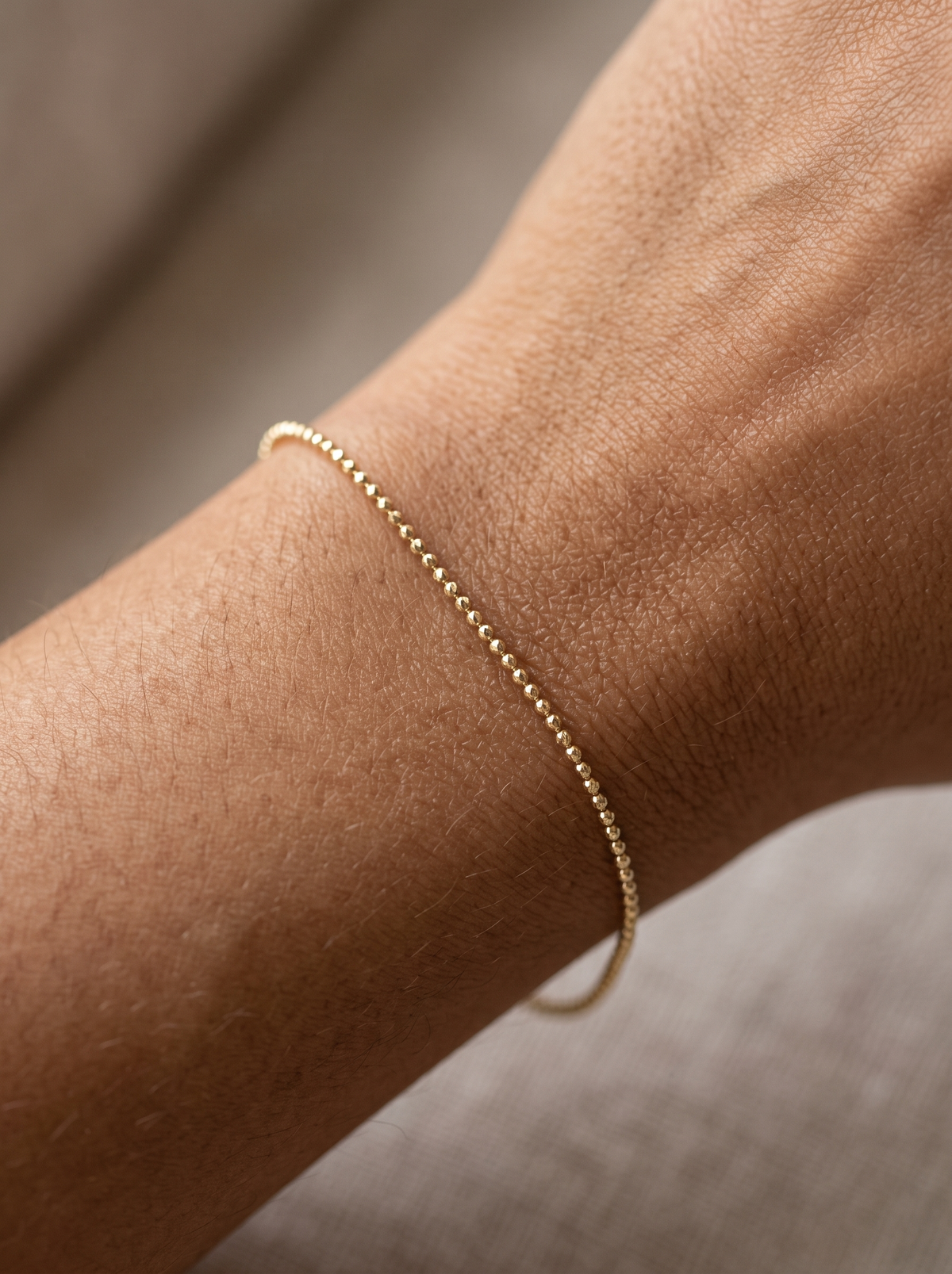 Diamond-Cut Bead Chain Bracelet in 14K Yellow Gold, shown close on the wrist