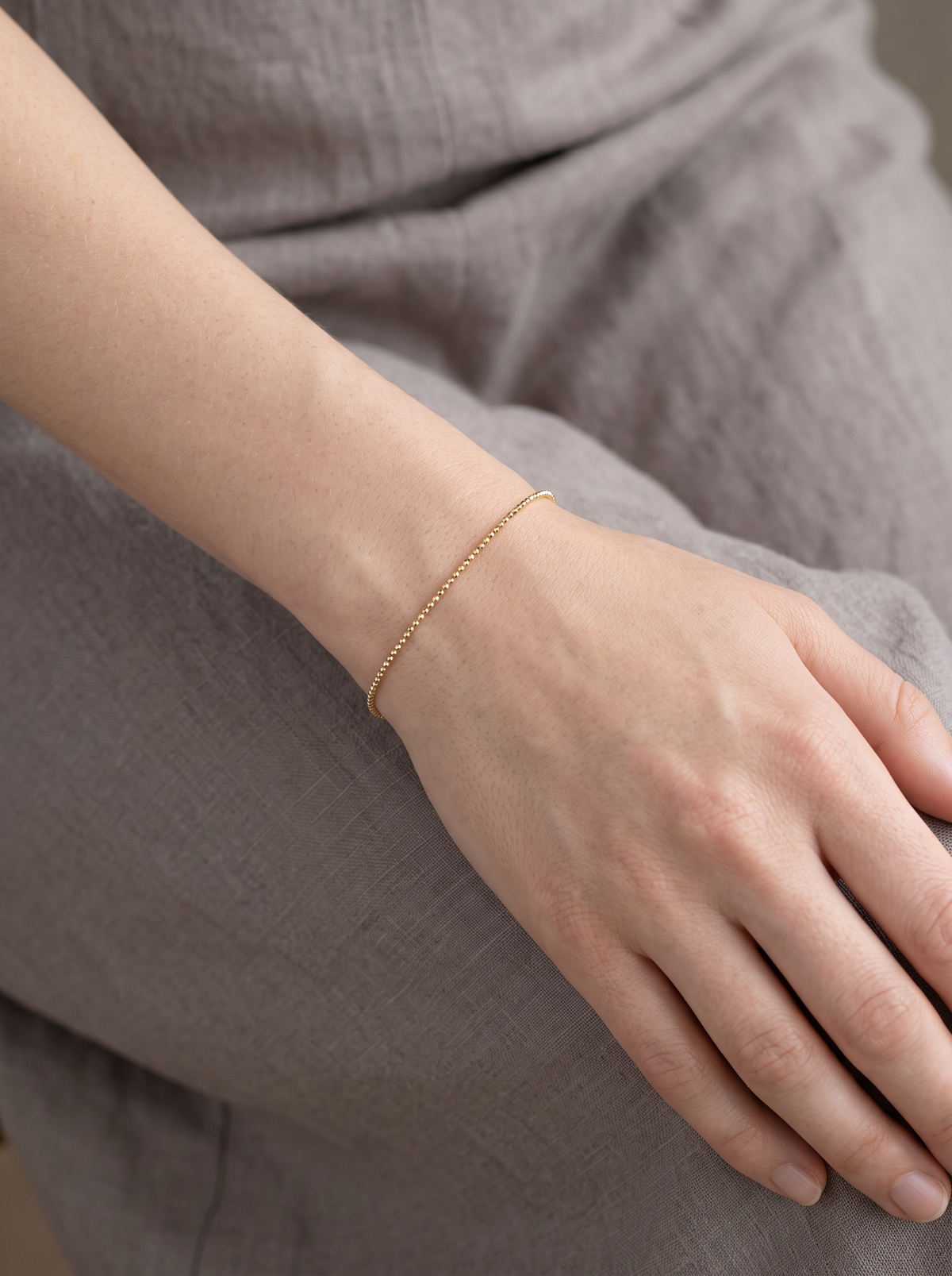 Diamond-Cut Bead Chain Bracelet in 14K Yellow Gold, worn on the wrist