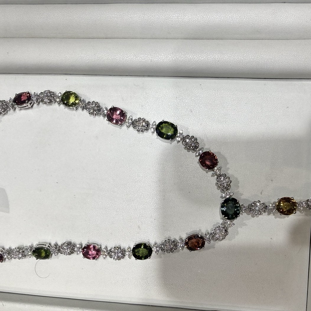 Multi-color gemstone and diamond necklace in a presentation tray