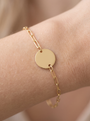 Engravable Disc Bracelet in 10K Yellow Gold, shown close on the wrist