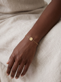 Engravable Disc Bracelet in 10K Yellow Gold, worn on the wrist