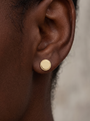Engravable Gold Rope Disc Stud Earrings in 14K Yellow Gold, shown close on the ear