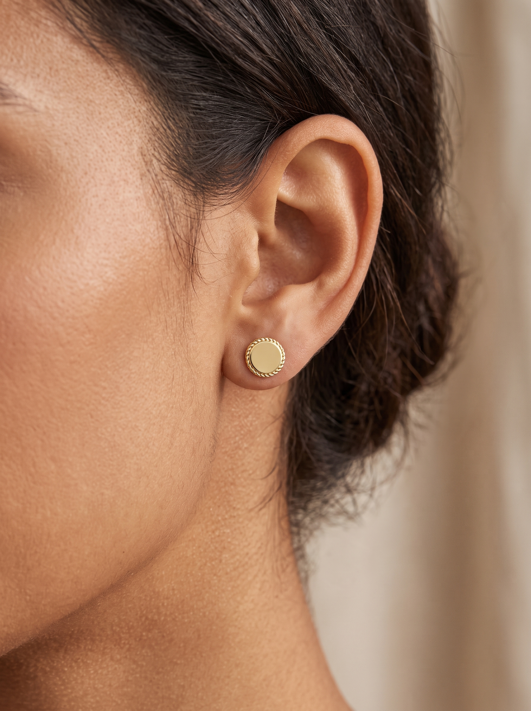 Engravable Gold Rope Disc Stud Earrings in 14K Yellow Gold, worn on the ear