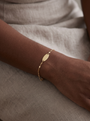 Engravable Keyhole Bracelet in 14K Yellow Gold, worn on the wrist