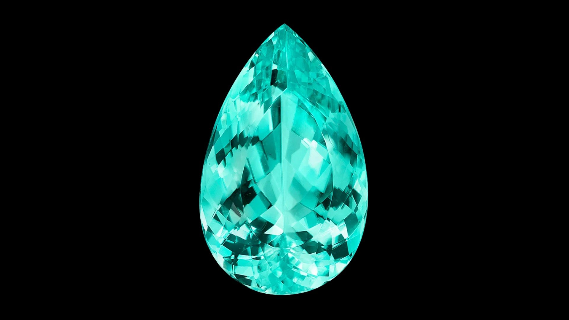 Pear-cut Paraíba-type tourmaline gemstone in neon teal on a black background
