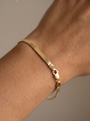 Herringbone Chain Bracelet in 14K Yellow Gold, shown close on the wrist