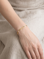 Herringbone Chain Bracelet in 14K Yellow Gold, worn on the wrist