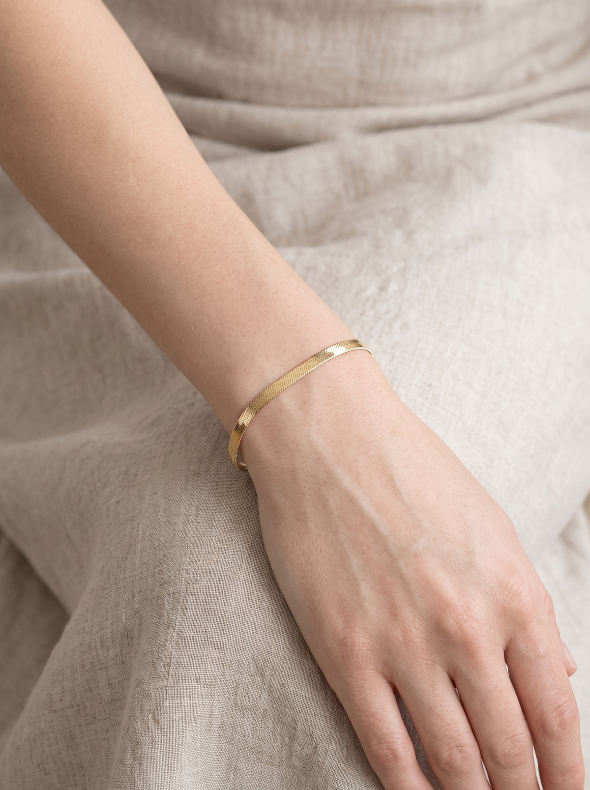Herringbone Chain Bracelet in 14K Yellow Gold, worn on the wrist