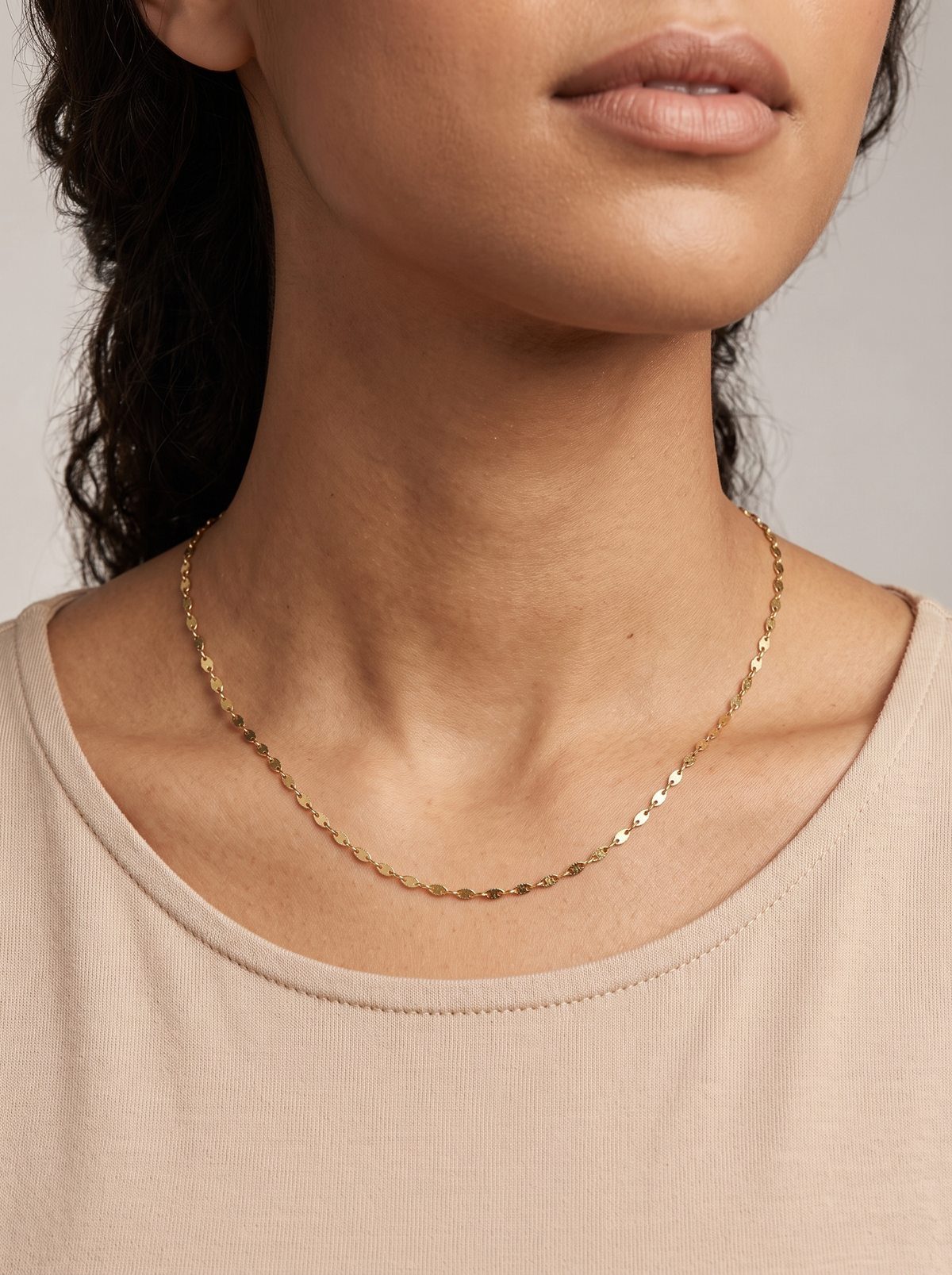 Gold Keyhole Chain Necklace, shown close at the collarbone