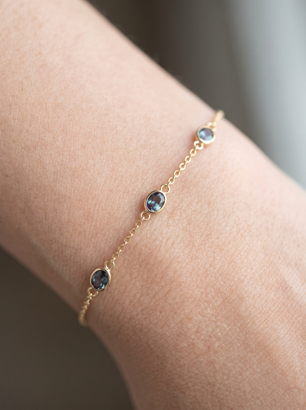 Lab-Grown Bezel-Set Gemstone Solitaire Bracelet in 14K Yellow Gold, shown close on the wrist