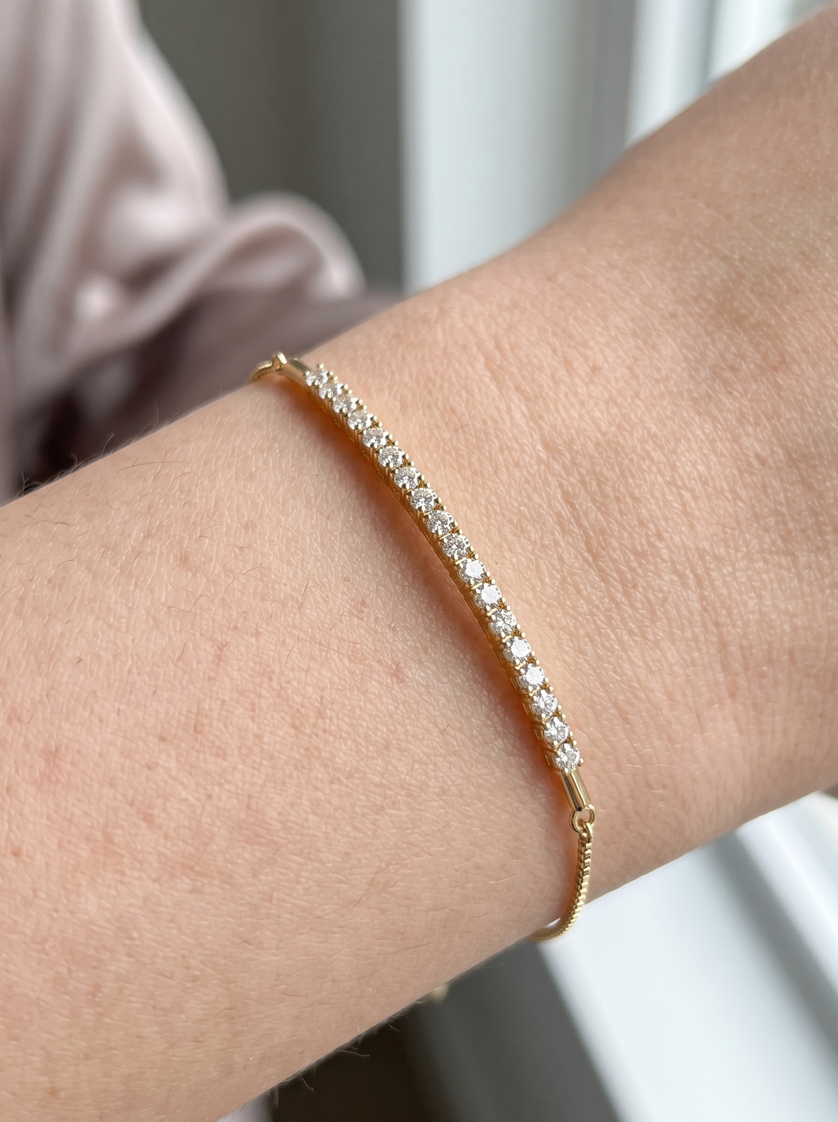 Lab-Grown Diamond Bar Bolo Bracelet in 14K Yellow Gold, shown close on the wrist