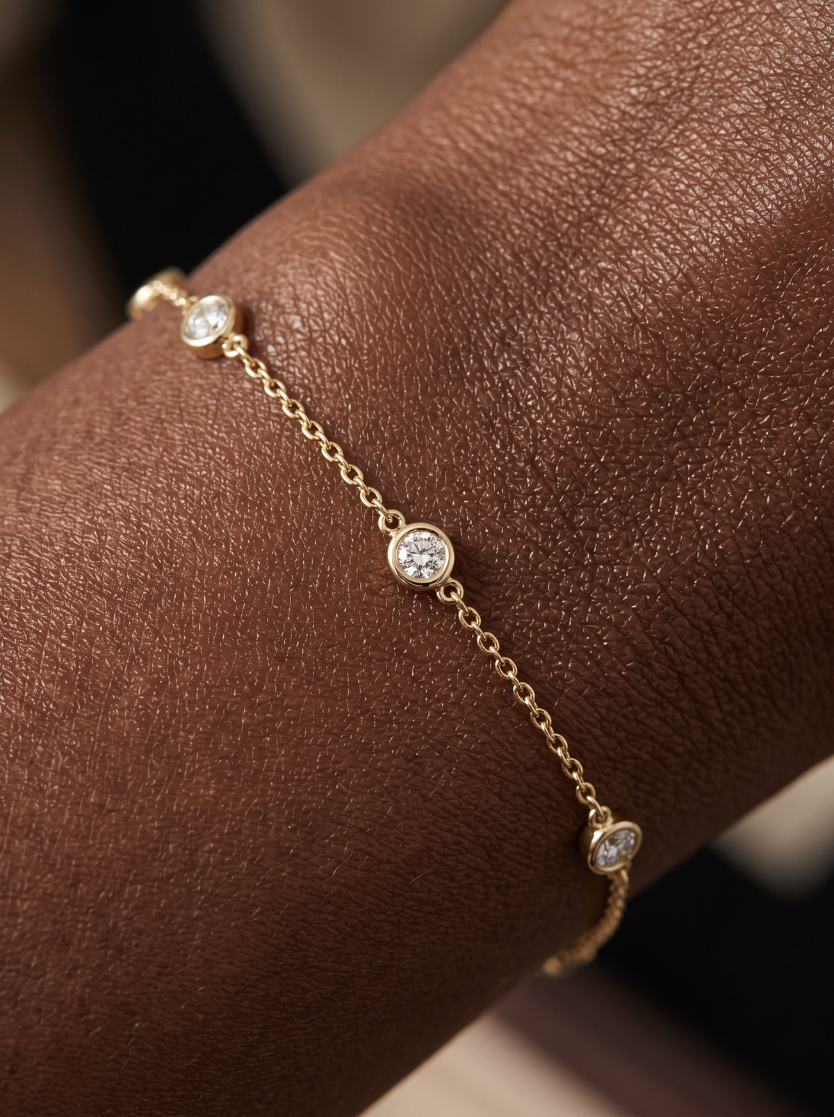 Lab-Grown Diamond Bezel Station Bracelet in 14K Yellow Gold, shown close on the wrist
