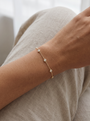 Lab-Grown Diamond Bezel Station Bracelet in 14K Yellow Gold, worn on the wrist