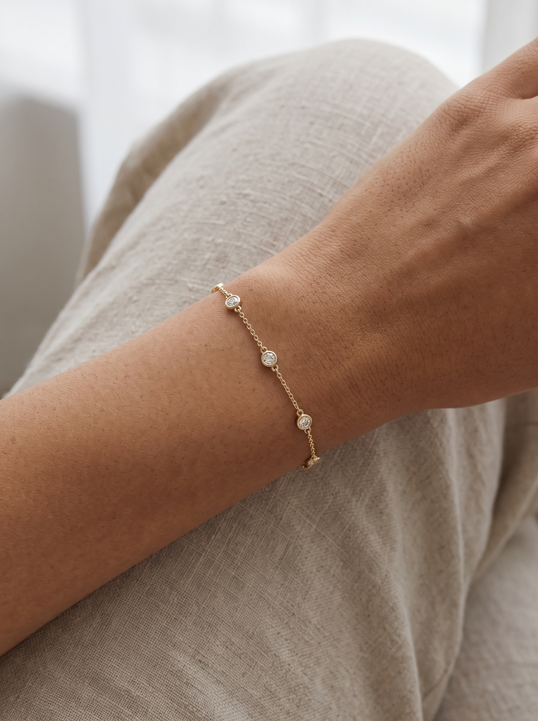 Lab-Grown Diamond Bezel Station Bracelet in 14K Yellow Gold, worn on the wrist