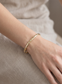Lab-Grown Diamond Detail Bangle in 14K Yellow Gold, shown close on the wrist
