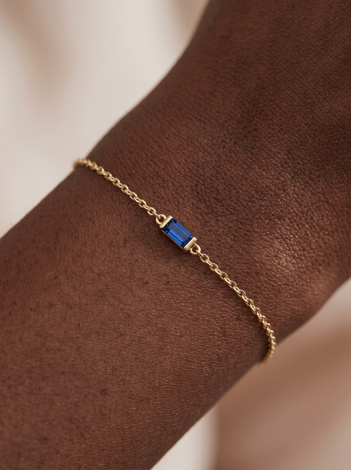 Lab-Grown Gemstone Baguette Bracelet in 14K Yellow Gold, shown close on the wrist
