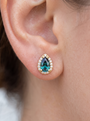 Lab-Grown Gemstone Pear Halo Stud Earrings in 14K Yellow Gold, shown close on the ear