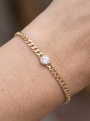 Natural Bezel-Set Gemstone Curb Bracelet in White Sapphire, Yellow Gold, shown close on the wrist