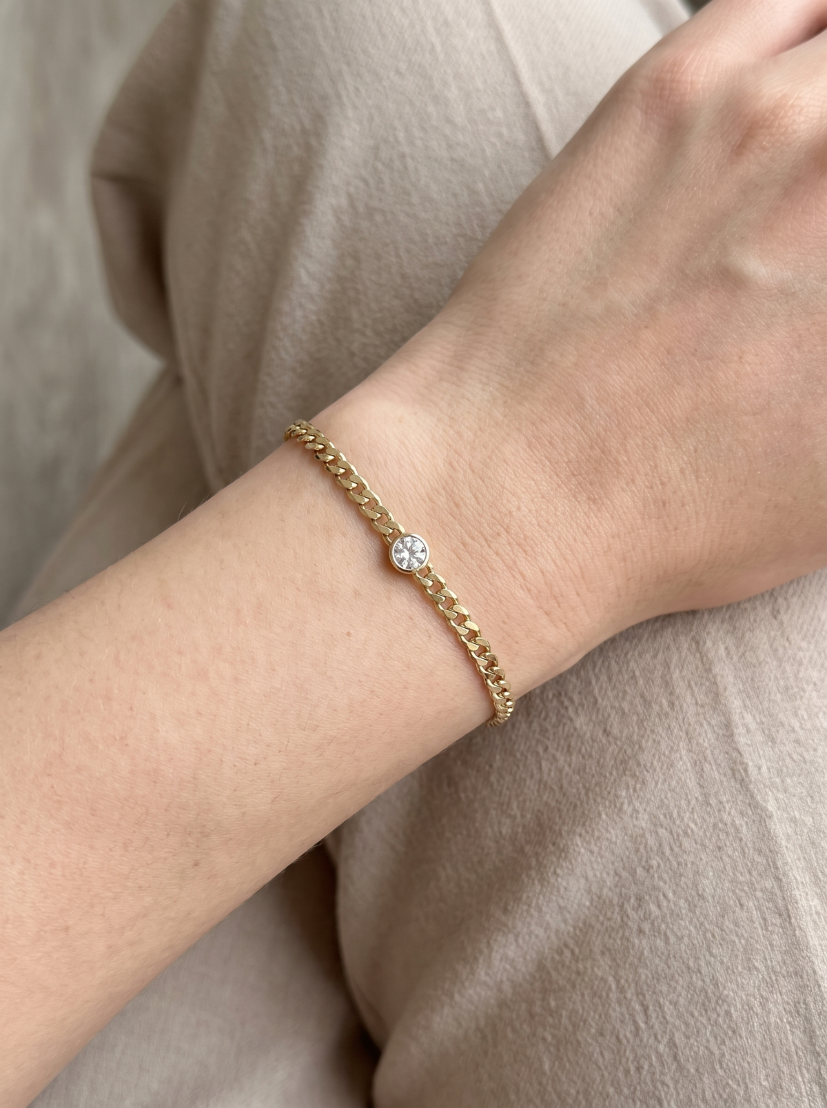 Natural Bezel-Set Gemstone Curb Bracelet in White Sapphire, Yellow Gold, worn on the wrist