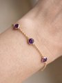 Natural Bezel-Set Gemstone Solitaire Bracelet in 14K Yellow Gold, shown close on the wrist