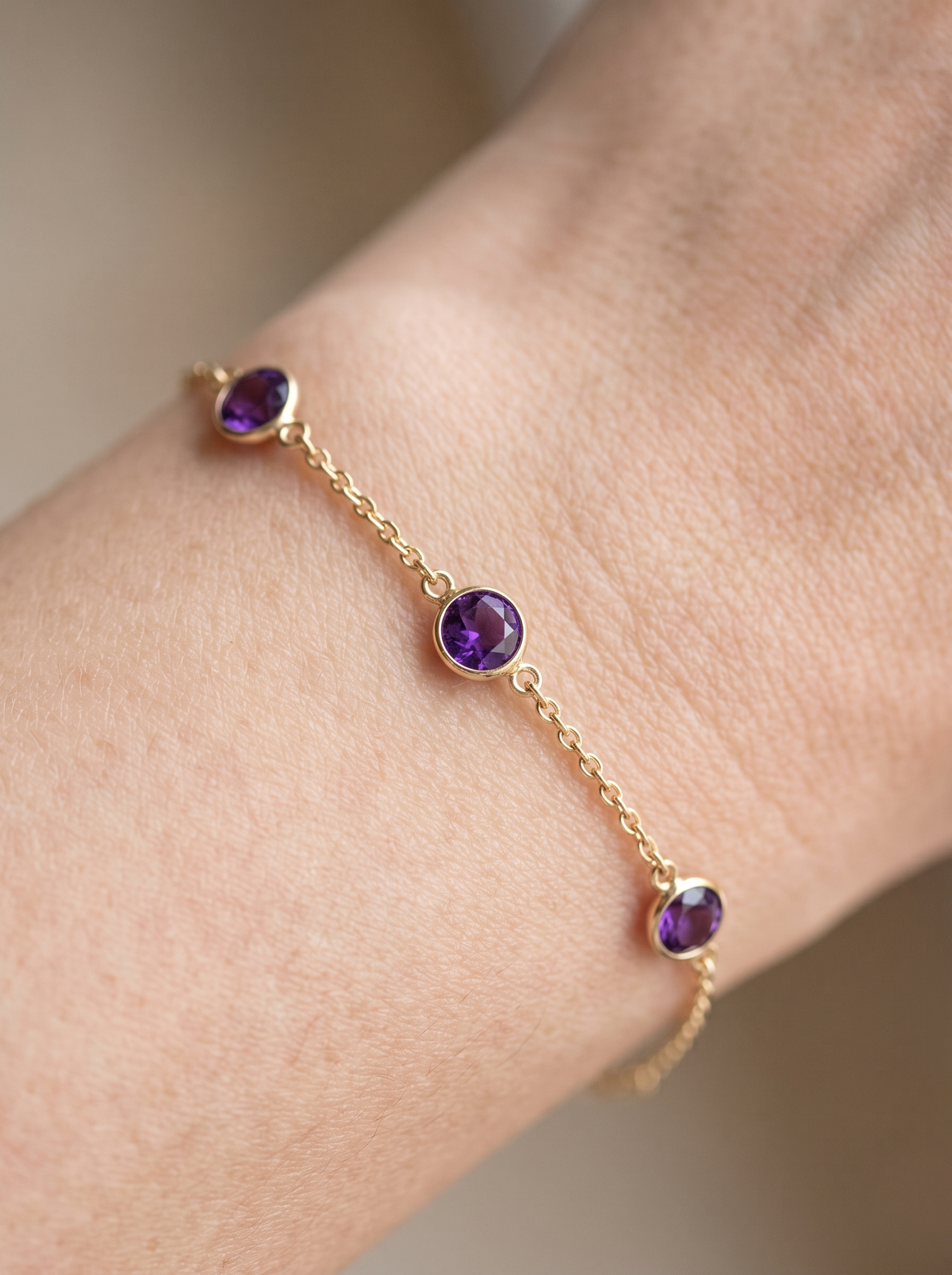 Natural Bezel-Set Gemstone Solitaire Bracelet in 14K Yellow Gold, shown close on the wrist