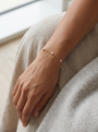 Natural Diamond Bezel Station Bracelet in 14K Yellow Gold, worn on the wrist