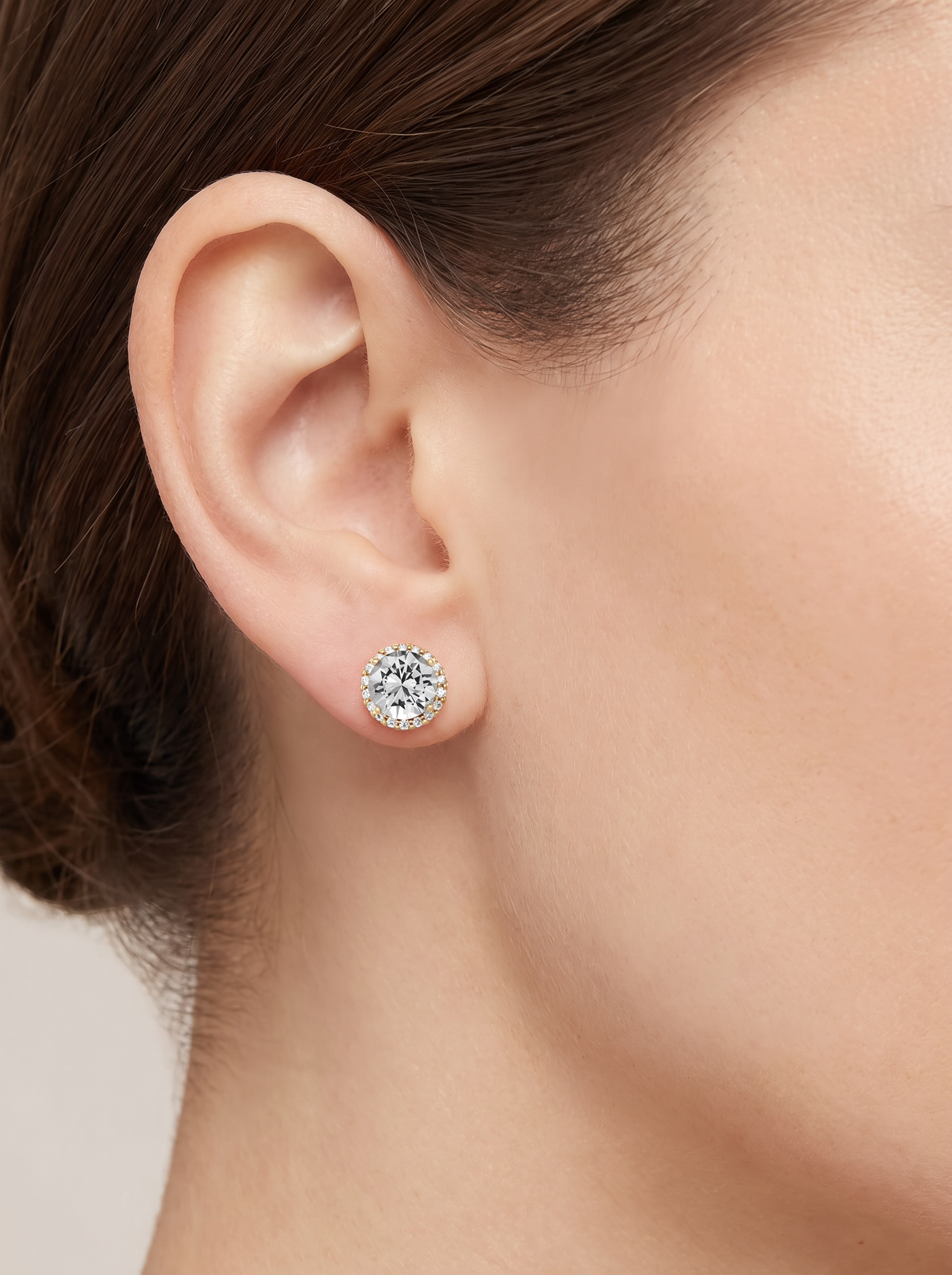 Natural Diamond Halo Stud Earrings in 14K Yellow Gold, worn on the ear